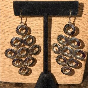 silver pierced earrings five layers with crystals inside each hammered circle